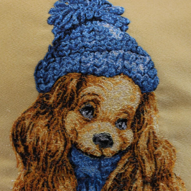 Siuvinėta pagalvė "Šuniukas su kepure"