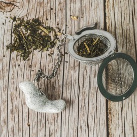 Arbatos sietelis su baltu paukšteliu Arbatos sietelis su baltu paukšteliu