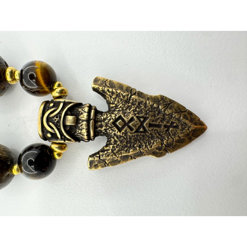 Vyriškas papuošalas iš gintaro su žalvarine ietimi