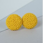 GERVUOGĖLĖS. Geltoni apvalūs auskarai 